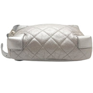 Bottom view of Chanel metallic silver quilted belt bag showing reinforced leather base corners and diamond quilted construction.