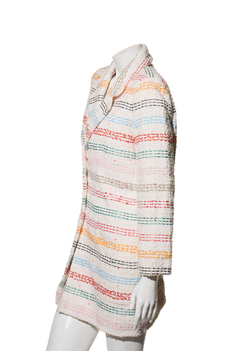 Chanel Rainbow Multicolored striped tweed coat on a mannequin against a white background left side view. 