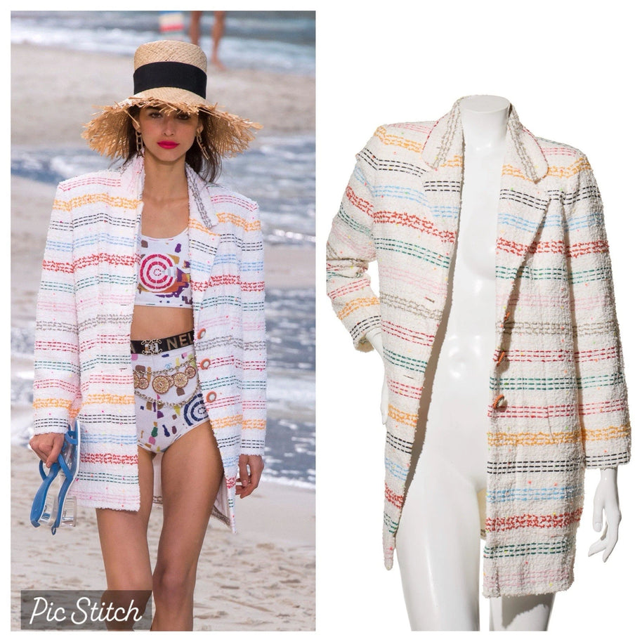 Model for Chanel 2019 Spring Collection Runway Show wearing a white Chanel with rainbow striped  detail tweed coat on a beach for reference, next to a mannequin wearing the same coat that is for sale.