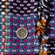Close-up of Chanel Tweed Coat Button and fringe detail decorative elements