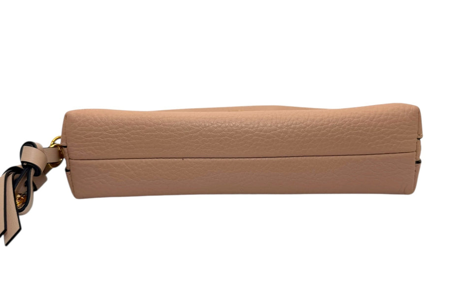 Bottom view of Chloé Alphabet half-moon pouch in blush nude calfskin showing smooth base and structured design.