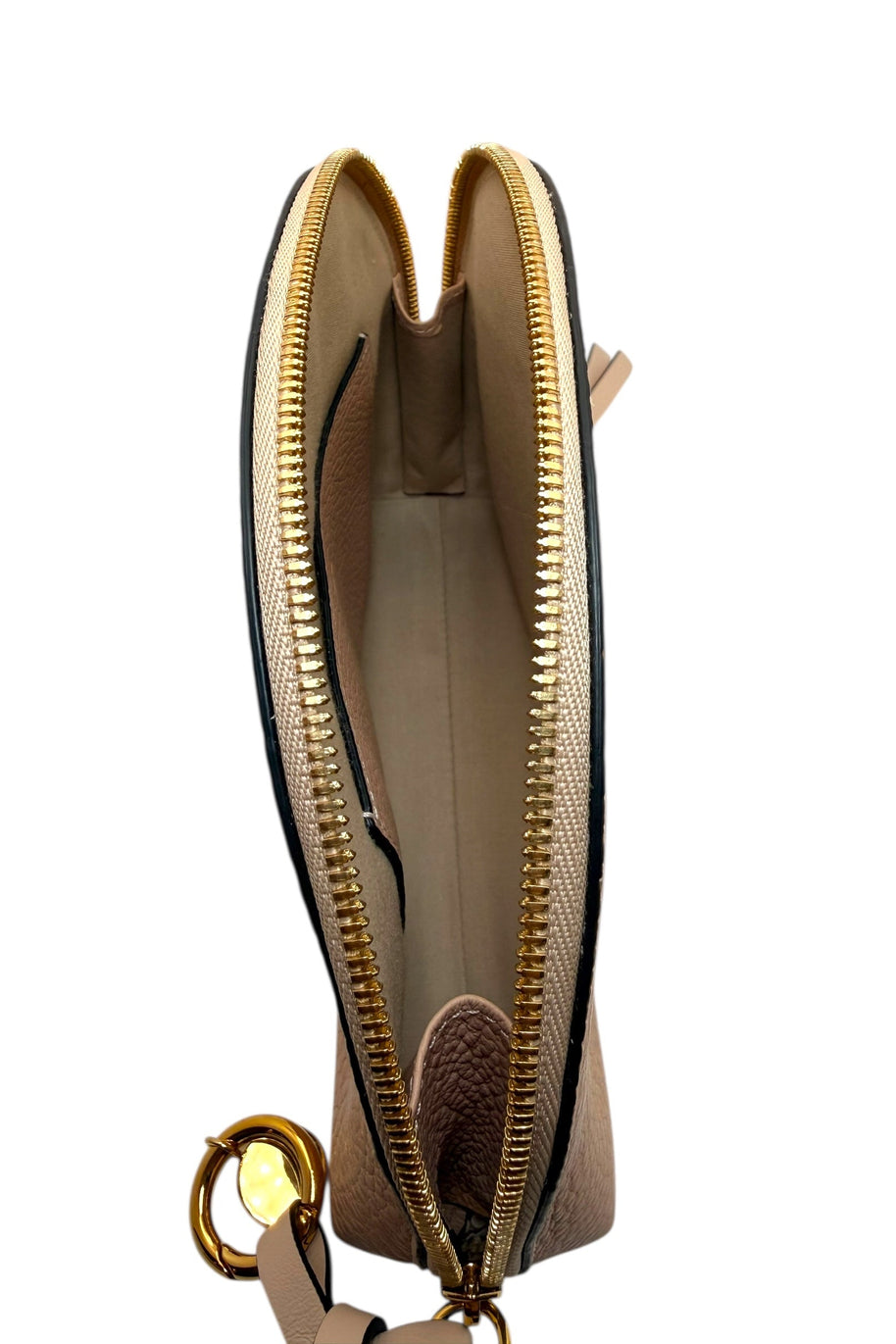 Angled top view of Chloé Alphabet blush leather half-moon pouch showing gold zipper, charm, and wrist strap detail.