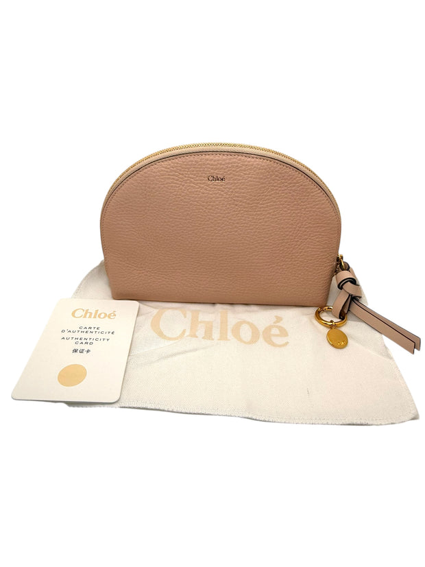 Chloé Alphabet blush leather pouch displayed with original dust bag and authenticity card, showcasing luxury designer cosmetic case.