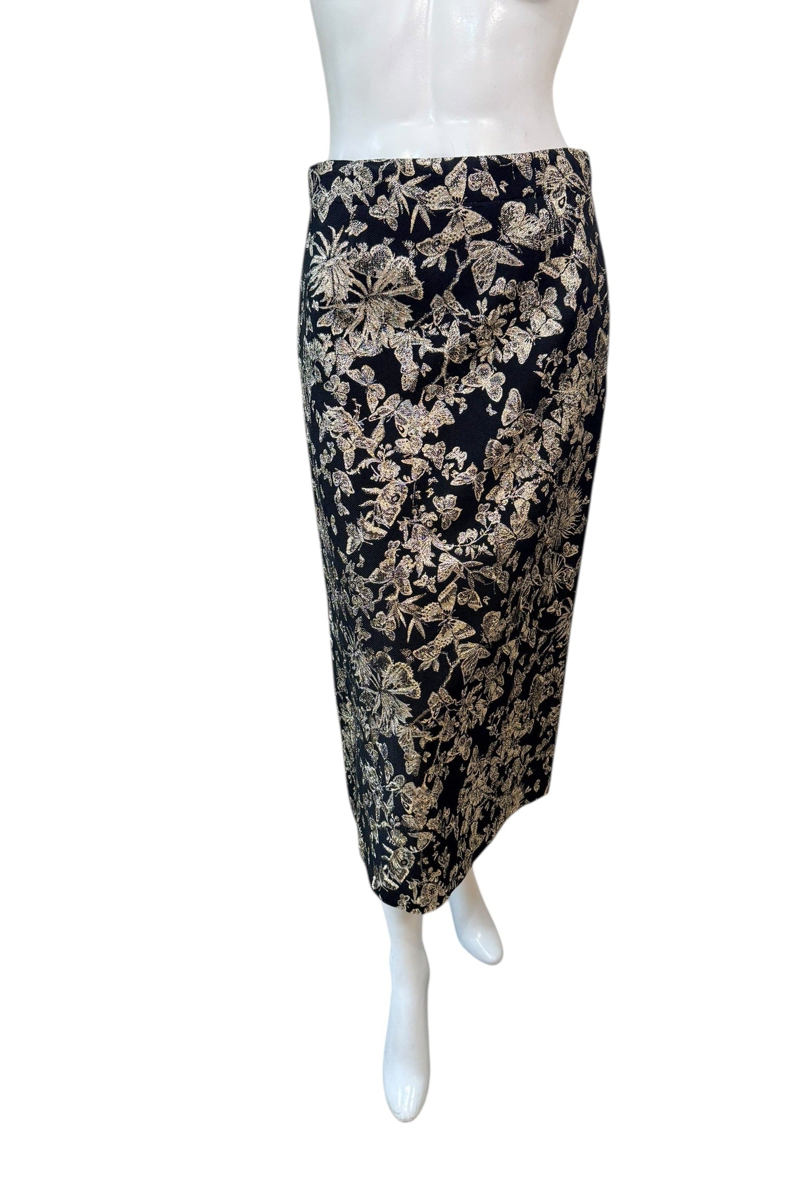 Front view of Christian Dior black midi skirt with gold metallic floral jacquard pattern, high-waisted pencil silhouette, made in Italy.