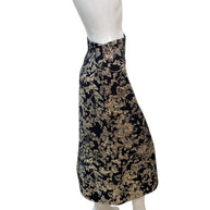 Side profile of Christian Dior metallic floral jacquard midi skirt highlighting tailored pencil silhouette and structured fabric.