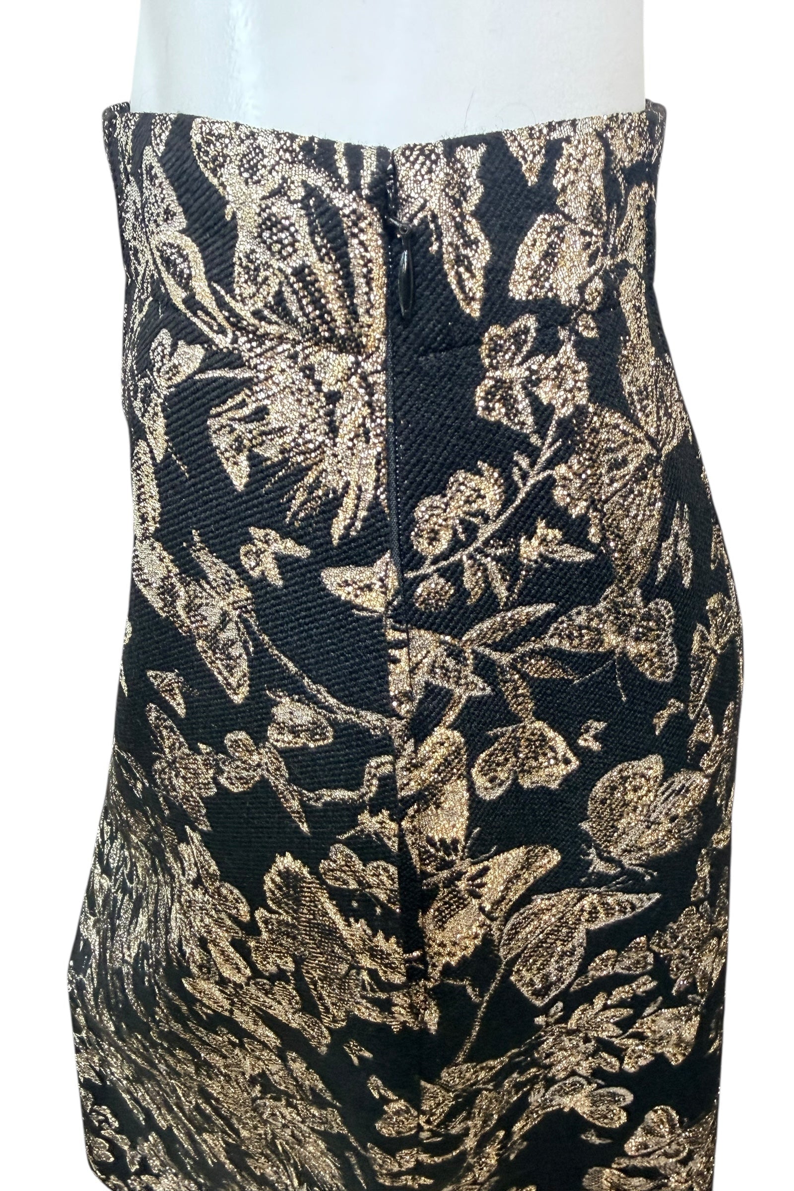 Close-up of side zipper and side pocket on Christian Dior black and gold metallic floral jacquard midi skirt with textured woven fabric.