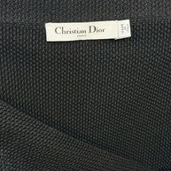 Interior label close-up of Christian Dior Paris knit skirt showing Made in Italy designer tag.