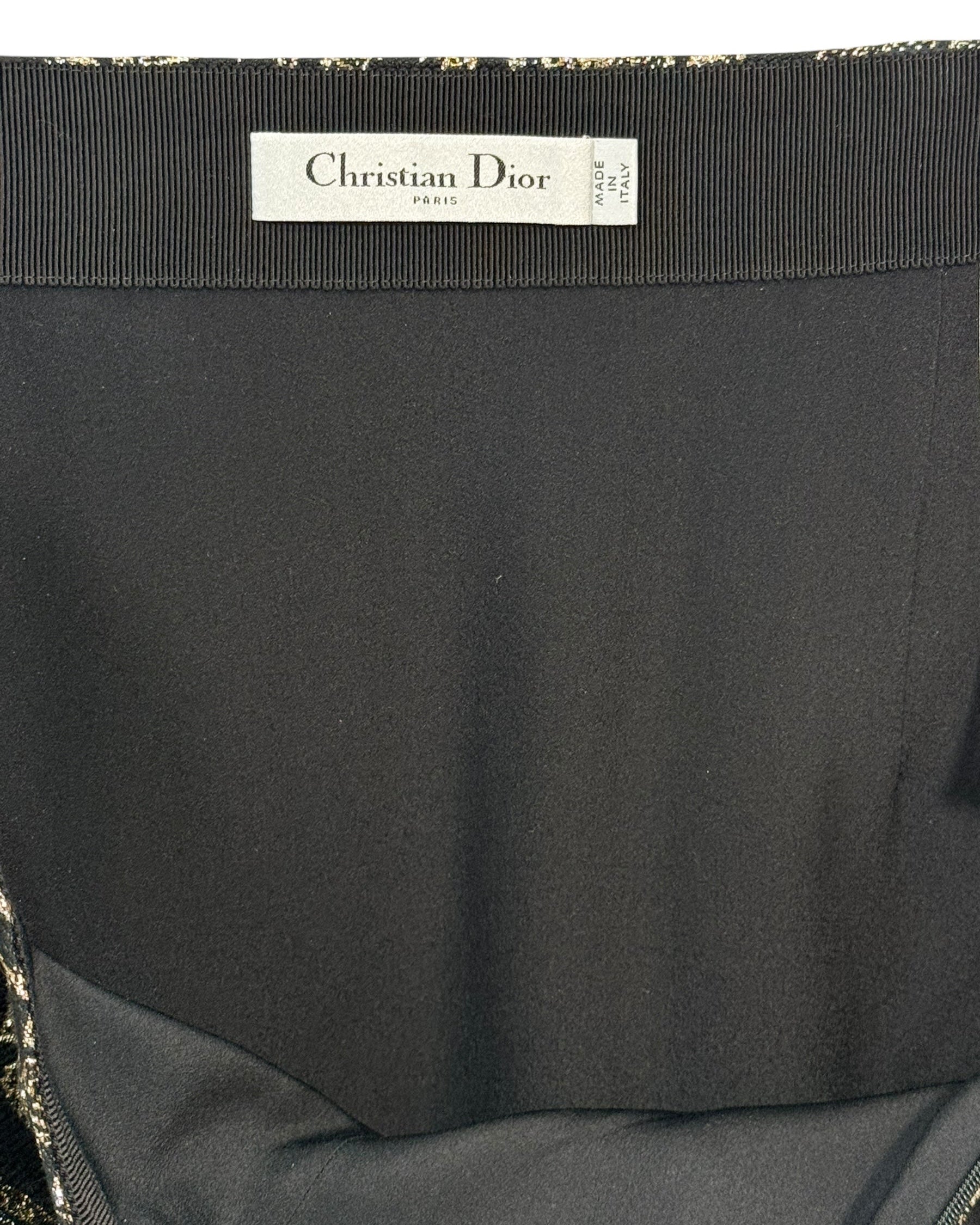Interior view of Christian Dior Paris label inside black and gold metallic jacquard midi skirt, made in Italy.
