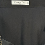 Interior view of Christian Dior Paris label inside black and gold metallic jacquard midi skirt, made in Italy.