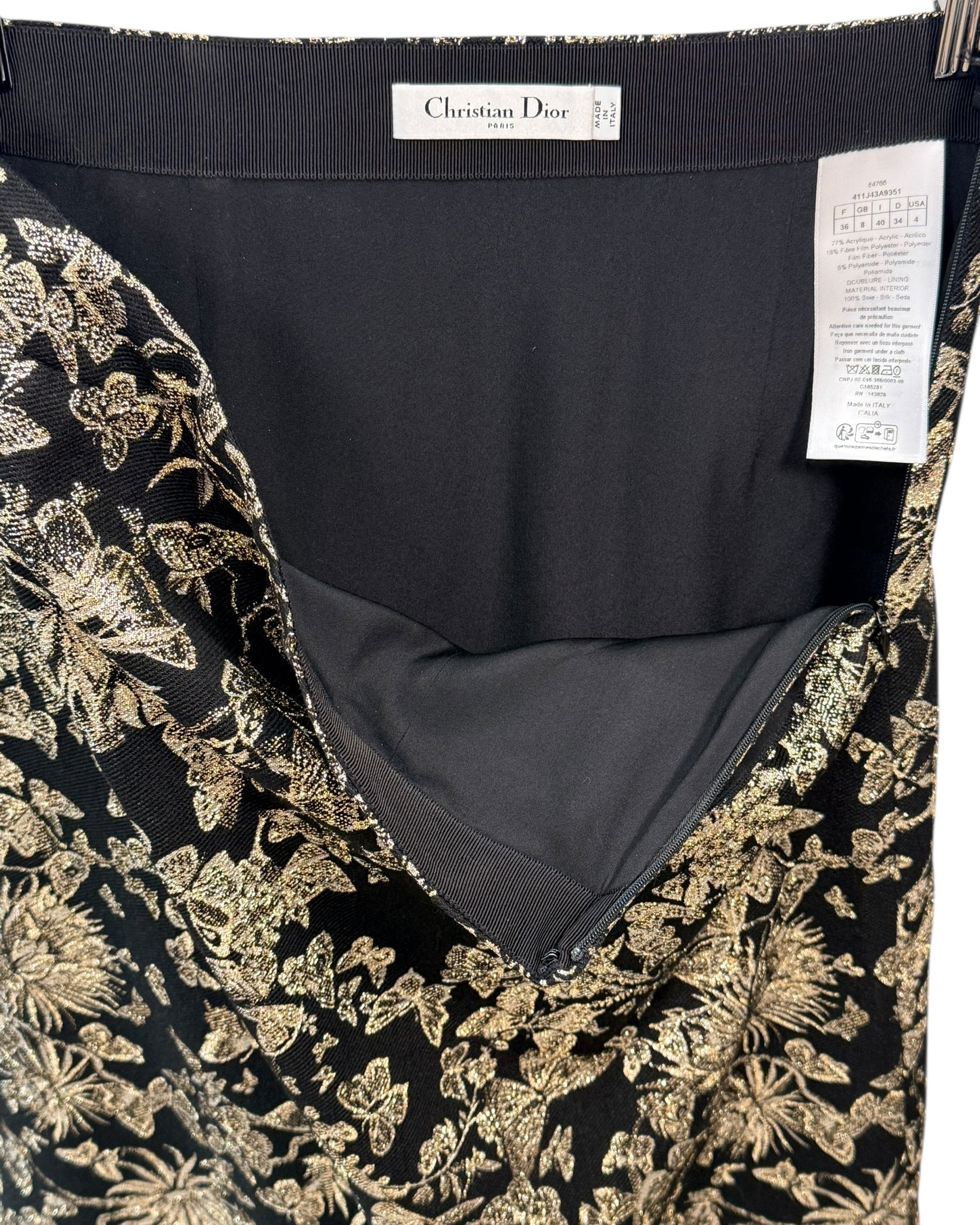 Interior view of Christian Dior metallic floral jacquard skirt showing black silk lining and craftsmanship details.