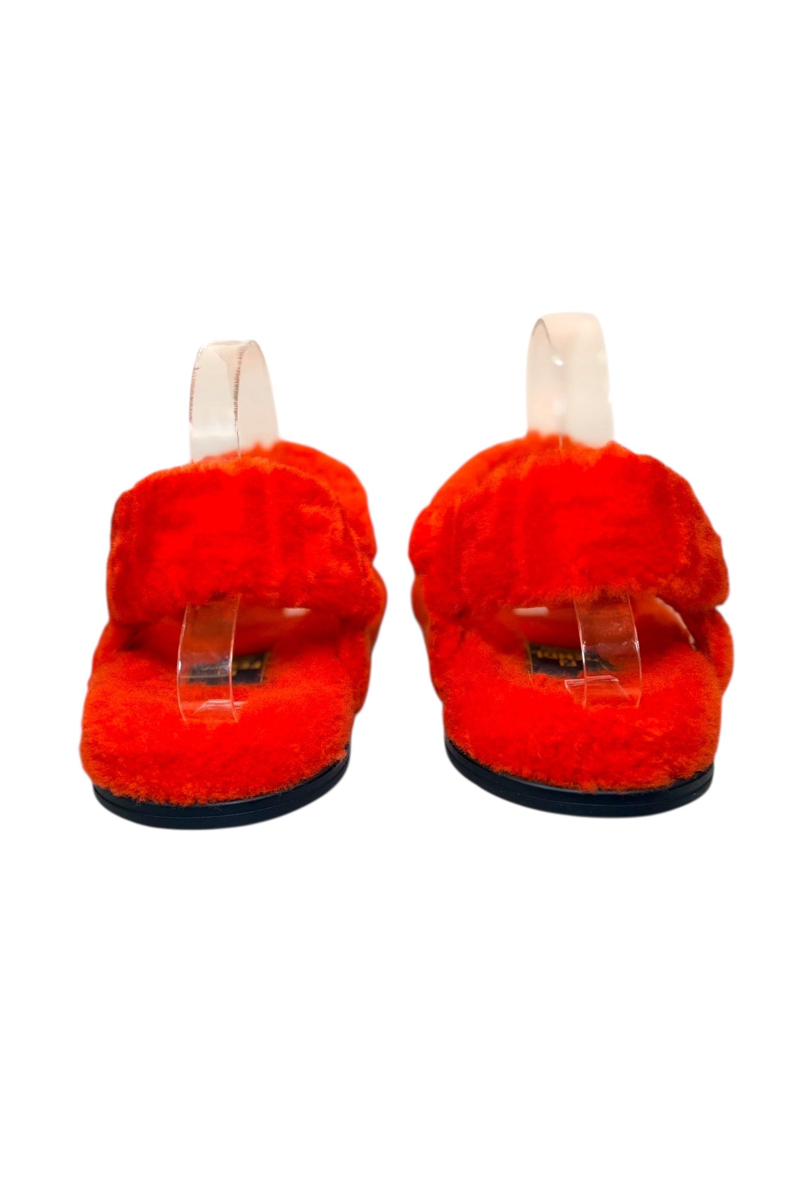 Rear view of Fendi red shearling sandals showing ankle strap and padded shearling heel area