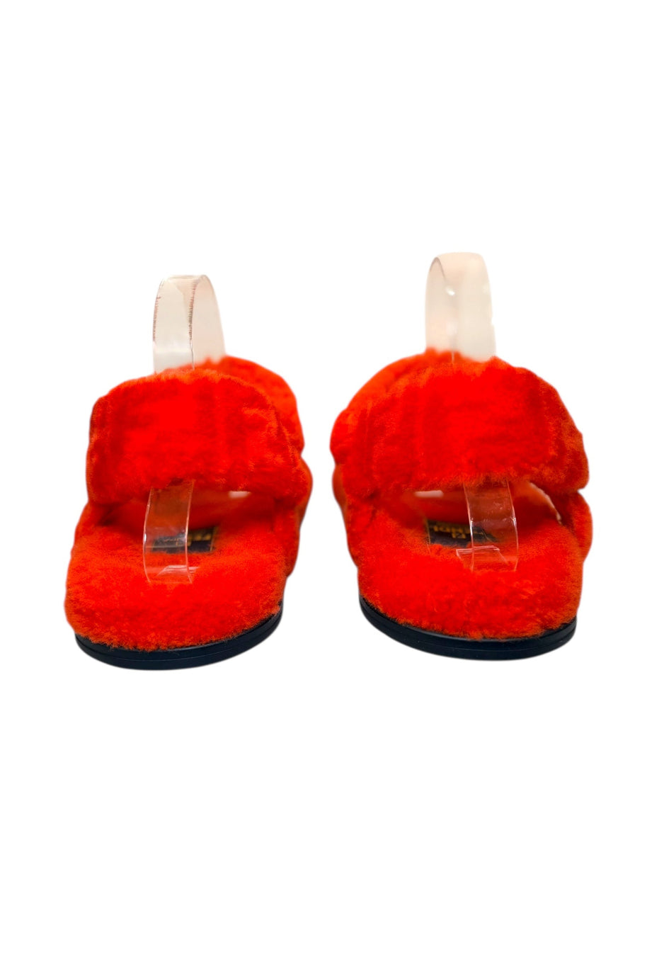 Rear view of Fendi red shearling sandals showing ankle strap and padded shearling heel area