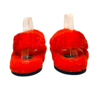 Rear view of Fendi red shearling sandals showing ankle strap and padded shearling heel area