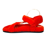 Right side view of Fendi red shearling flat sandals with ankle strap and cushioned shearling footbed