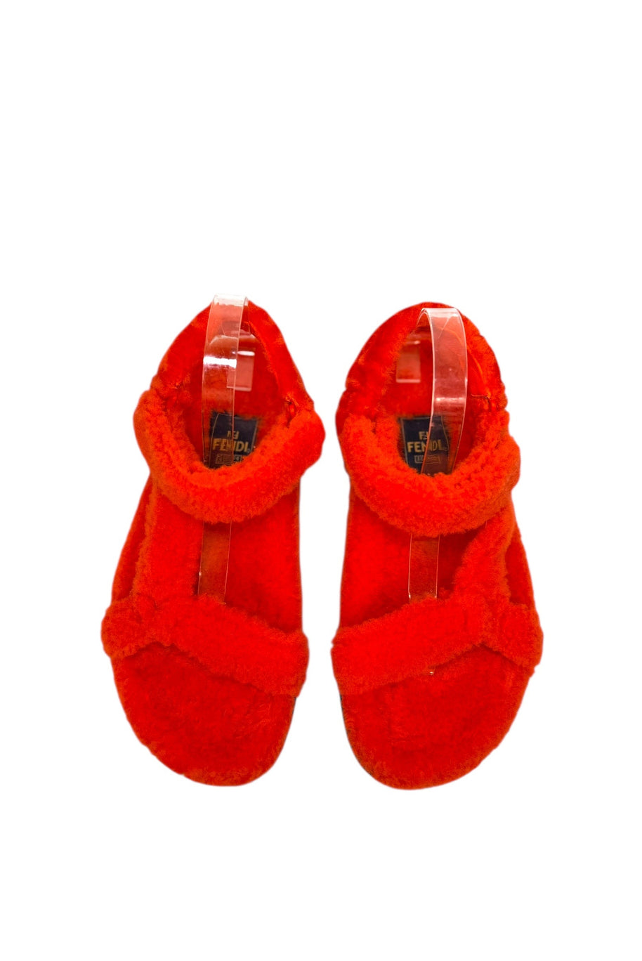 Top view of Fendi red shearling flat sandals showcasing plush footbed and strap placement