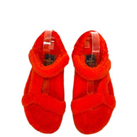 Top view of Fendi red shearling flat sandals showcasing plush footbed and strap placement