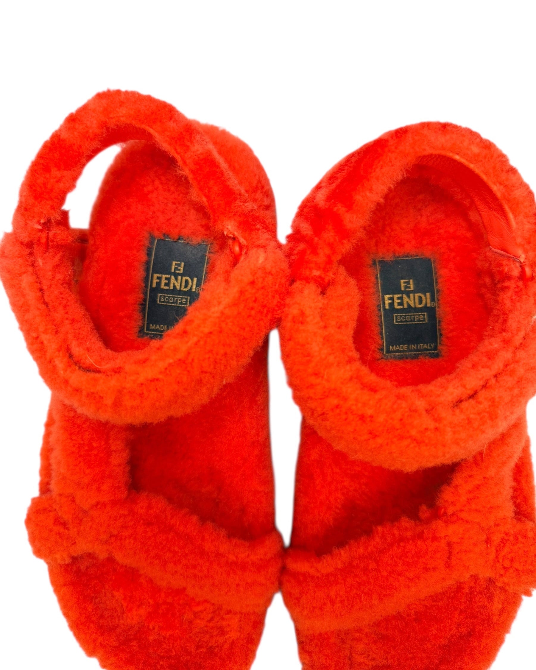 Interior view of Fendi red shearling sandals with Fendi Scarpe logo label and made in Italy marking