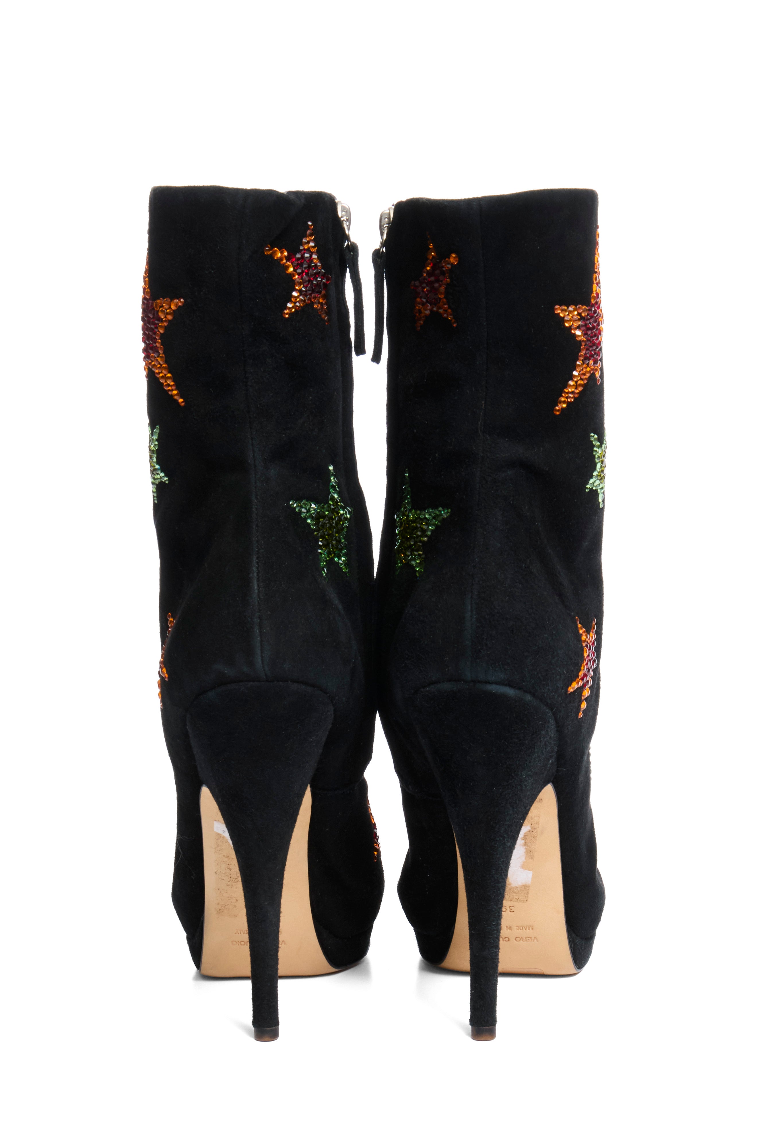 Giuseppe Zanotti Black suede high-heeled boots with star designs back view on a white background