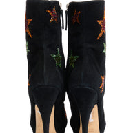 Giuseppe Zanotti Black suede high-heeled boots with star designs back view on a white background