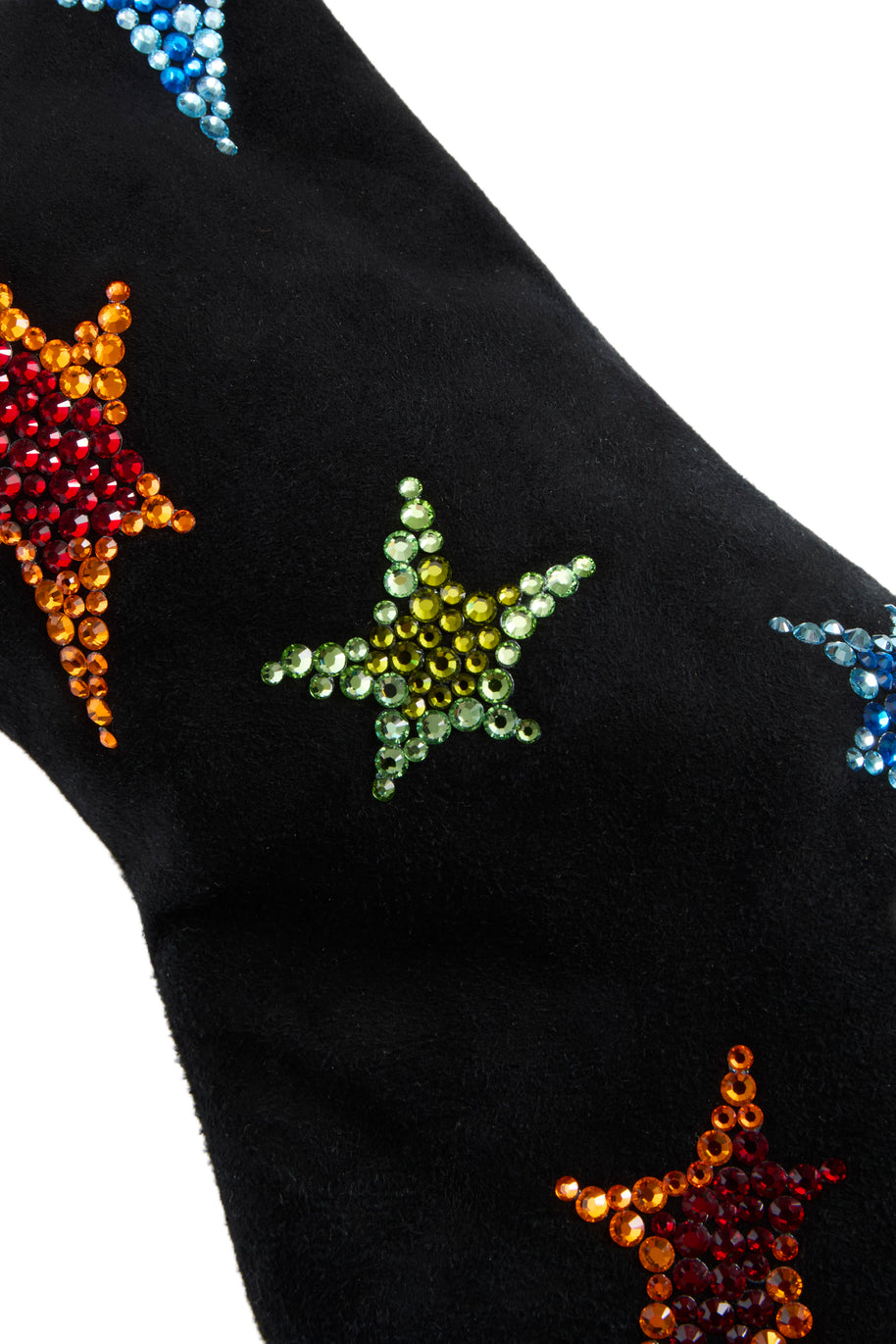 Black suede Giuseppe Zanotti Boot close up view of colorful star patterns on a white background