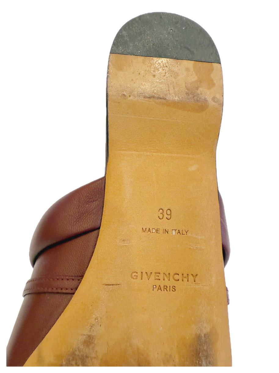 Close-up of a Givenchy burgundy slide shoe sole with 'Made in Italy' and 'Givenchy Paris' and '39' text.
