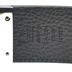 Reversible view of Gucci leather belt showing made in Italy stamp, style code 449715 CAO2N, and authentic branding details.