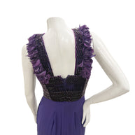 Close-up of the back bodice on Gucci gown showing beading, pleating, and feather trim.