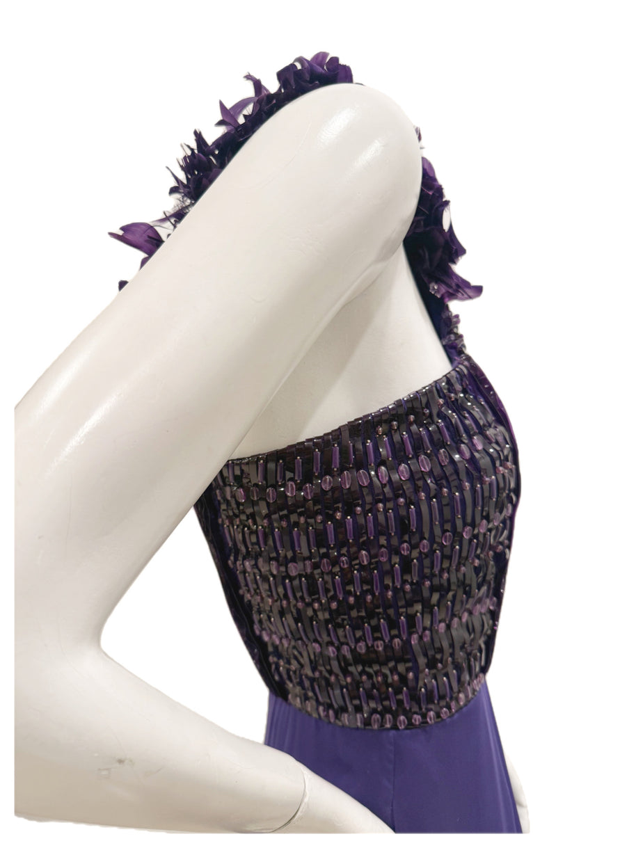 Close-up side image of Gucci gown highlighting textured beadwork and pleated satin on bodice.