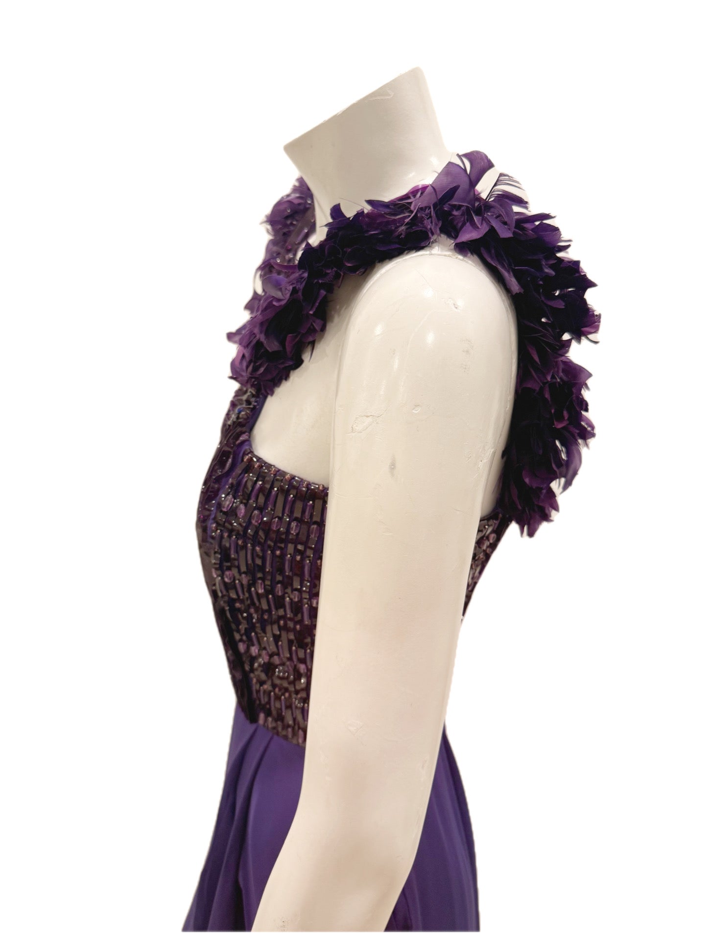 Close-up of purple feather-trim strap on Gucci evening gown.