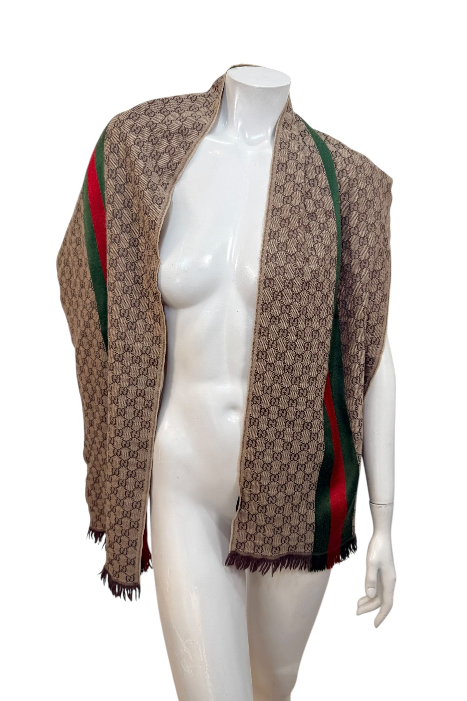 Gucci GG monogram wool silk scarf with green red web stripe draped on mannequin, made in Italy