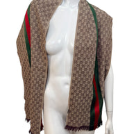 Gucci GG monogram wool silk scarf with green red web stripe draped on mannequin, made in Italy