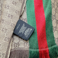 Gucci GG monogram scarf care label with material composition and Italian manufacture