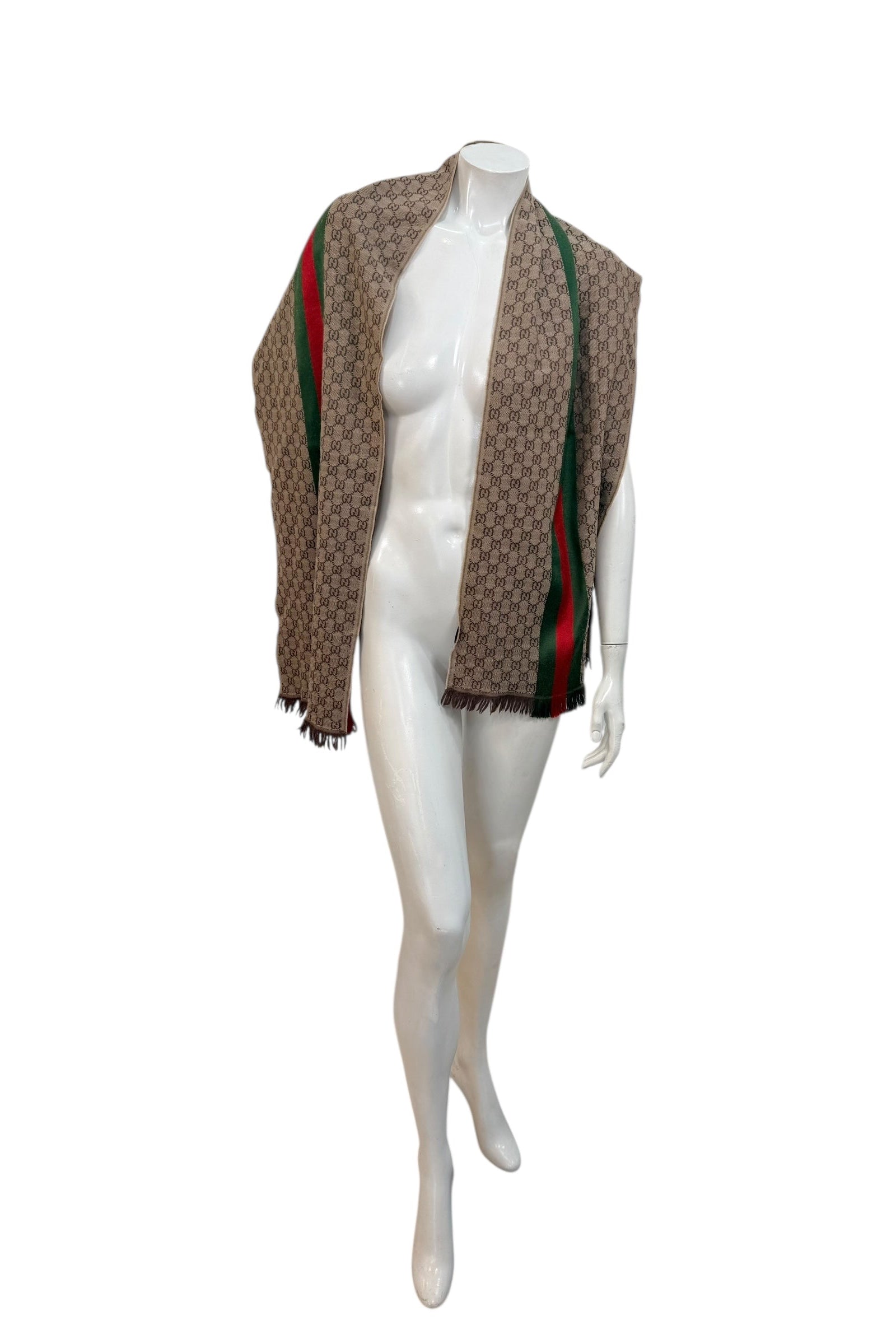 Full length view of Gucci GG monogram scarf with signature green red stripe and fringe trim