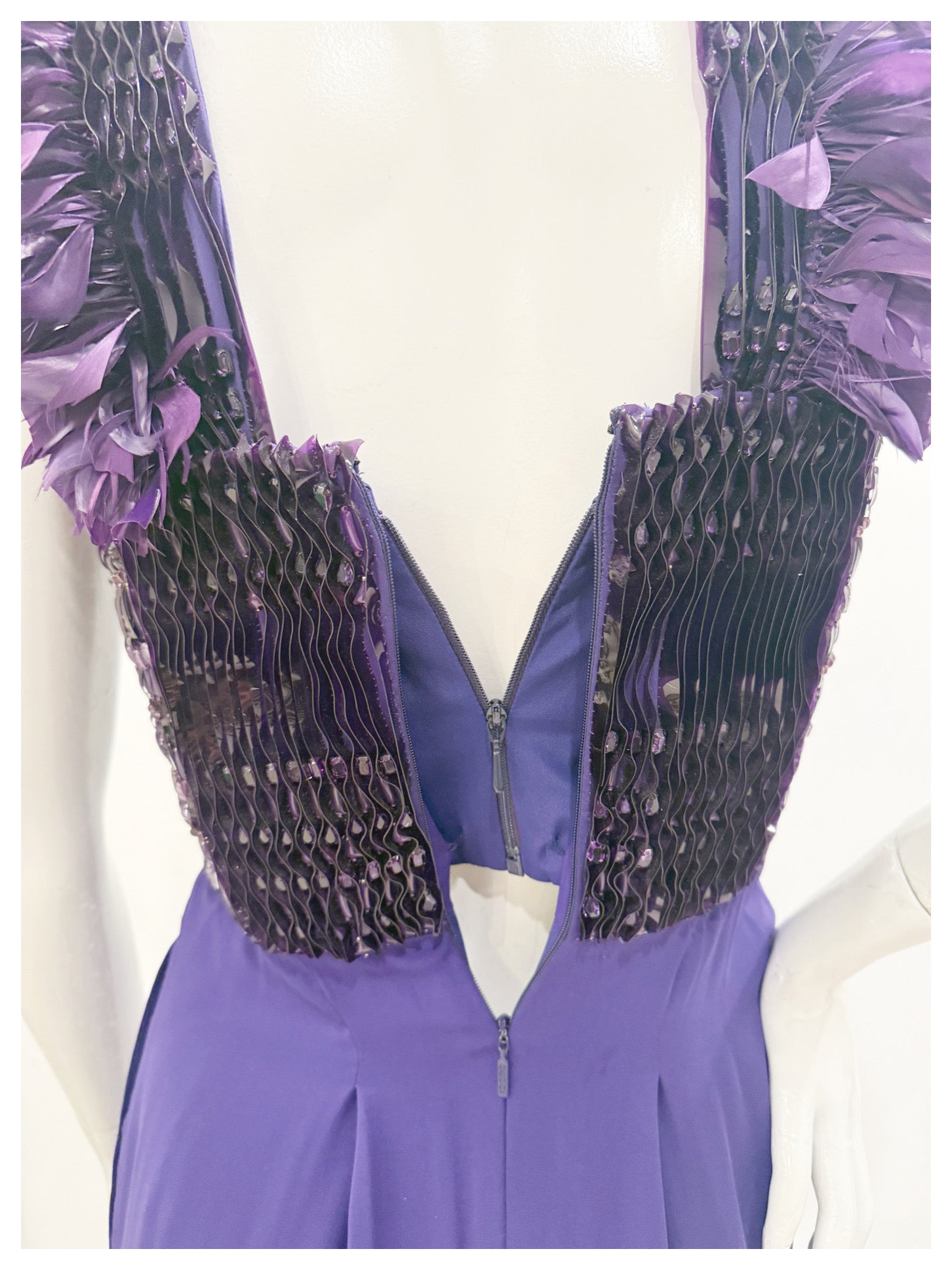 Close-up of back zipper and interior corset construction on Gucci purple embellished gown.