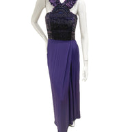 Front view of Gucci purple embellished evening gown with beaded bodice and feather-trim straps on mannequin.