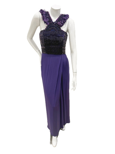 Front view of Gucci purple embellished evening gown with beaded bodice and feather-trim straps on mannequin.