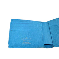 Close-up of Louis Vuitton SS23 Comics Wallet left interior card slots with blue textured leather and clean stitching.