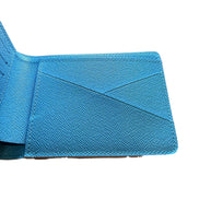 Detailed view of interior panel of Louis Vuitton SS23 Comics Wallet featuring blue textured leather and card slots.