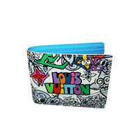 Louis Vuitton SS23 Comics Wallet photographed at angle revealing vibrant print and blue leather interior.