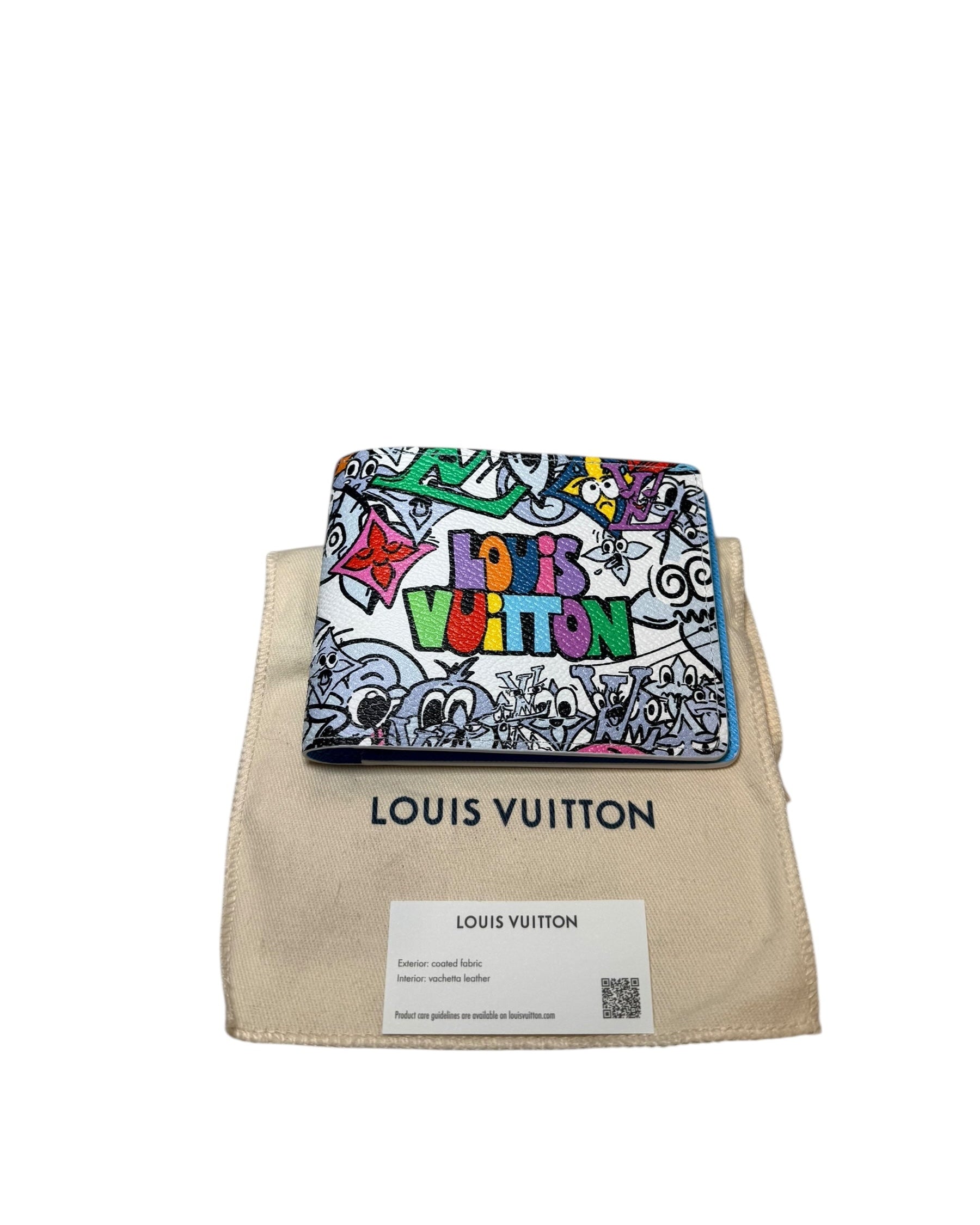 Centered front view of Louis Vuitton SS23 Comics Wallet resting on dust bag with multicolor graphic artwork.