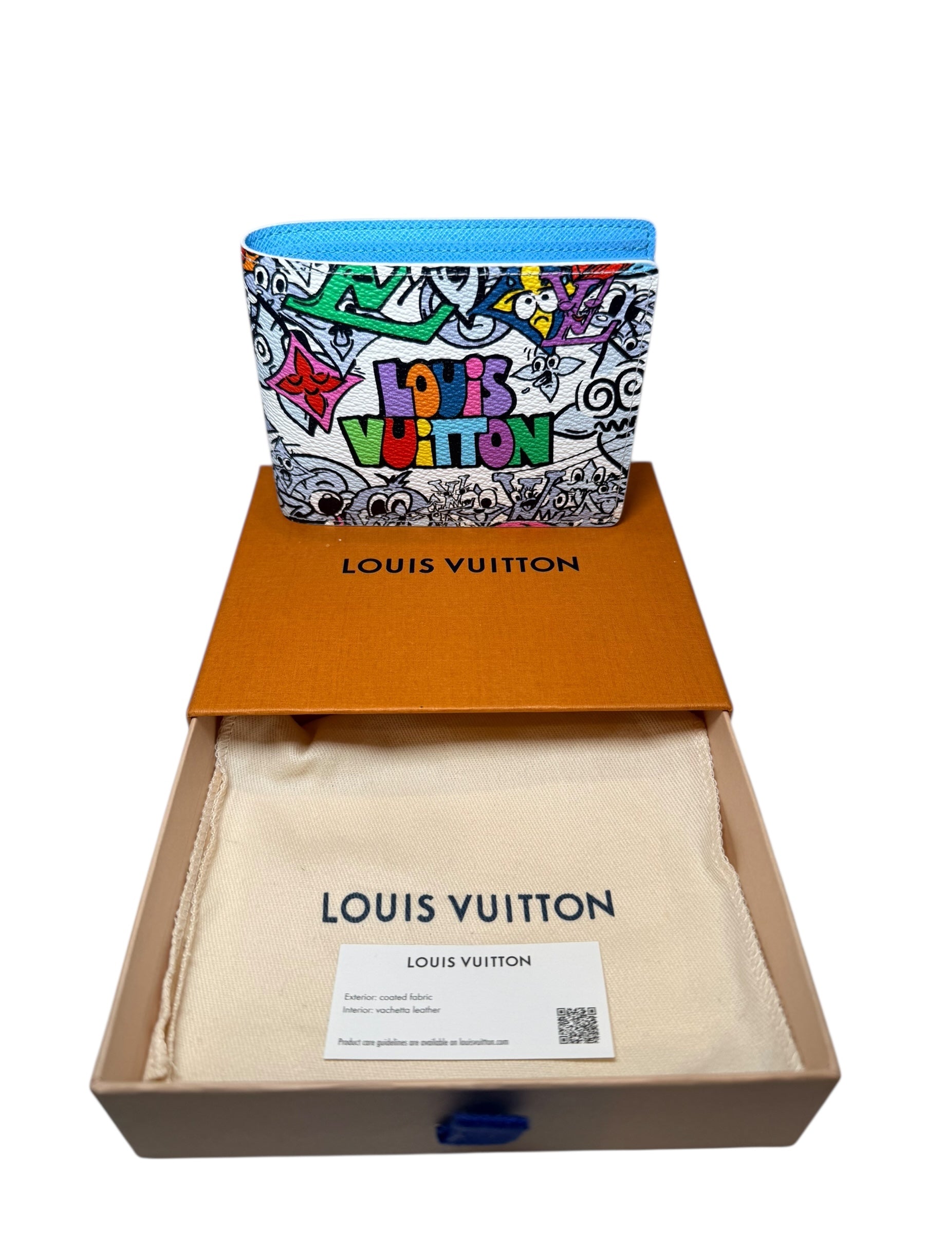 Louis Vuitton SS23 Comics Wallet shown with open box dust bag and care card included full set packaging.