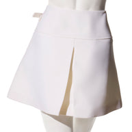 Back view of the Louis Vuitton Spring/Summer 2019 white mini skirt featuring the structured paneling and center back pleat.