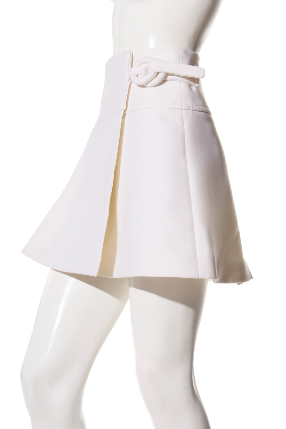 Right side view of the Louis Vuitton SS19 white mini skirt showcasing the signature fabric-covered ring fastening and crisp architectural lines.