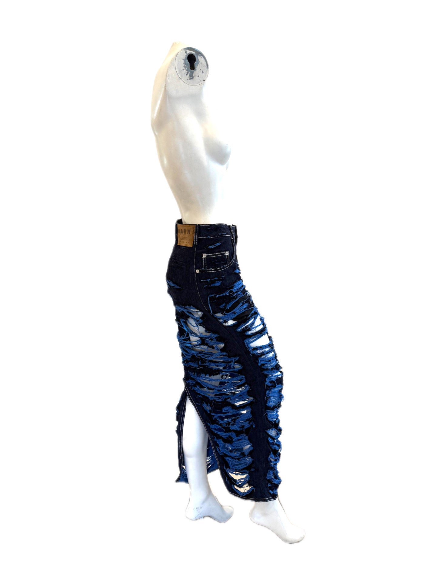 Mannequin wearing a Marni distressed blue denim skirt on a white background