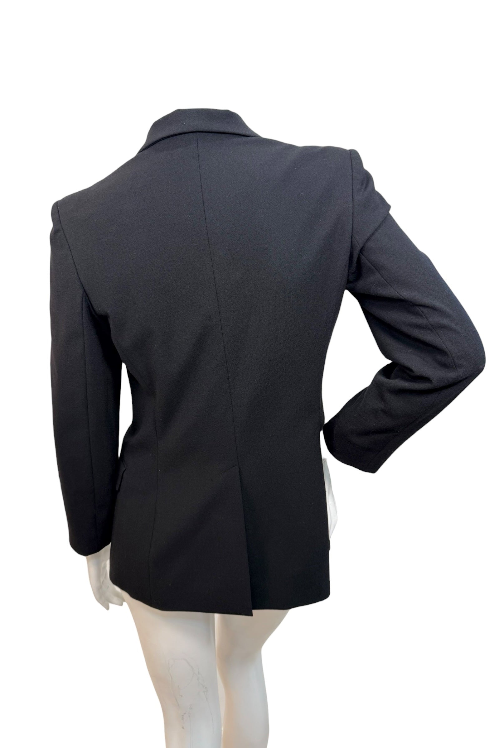 Back view of vintage Moschino Jeans black blazer displaying clean tailoring and structured fit, made in Italy