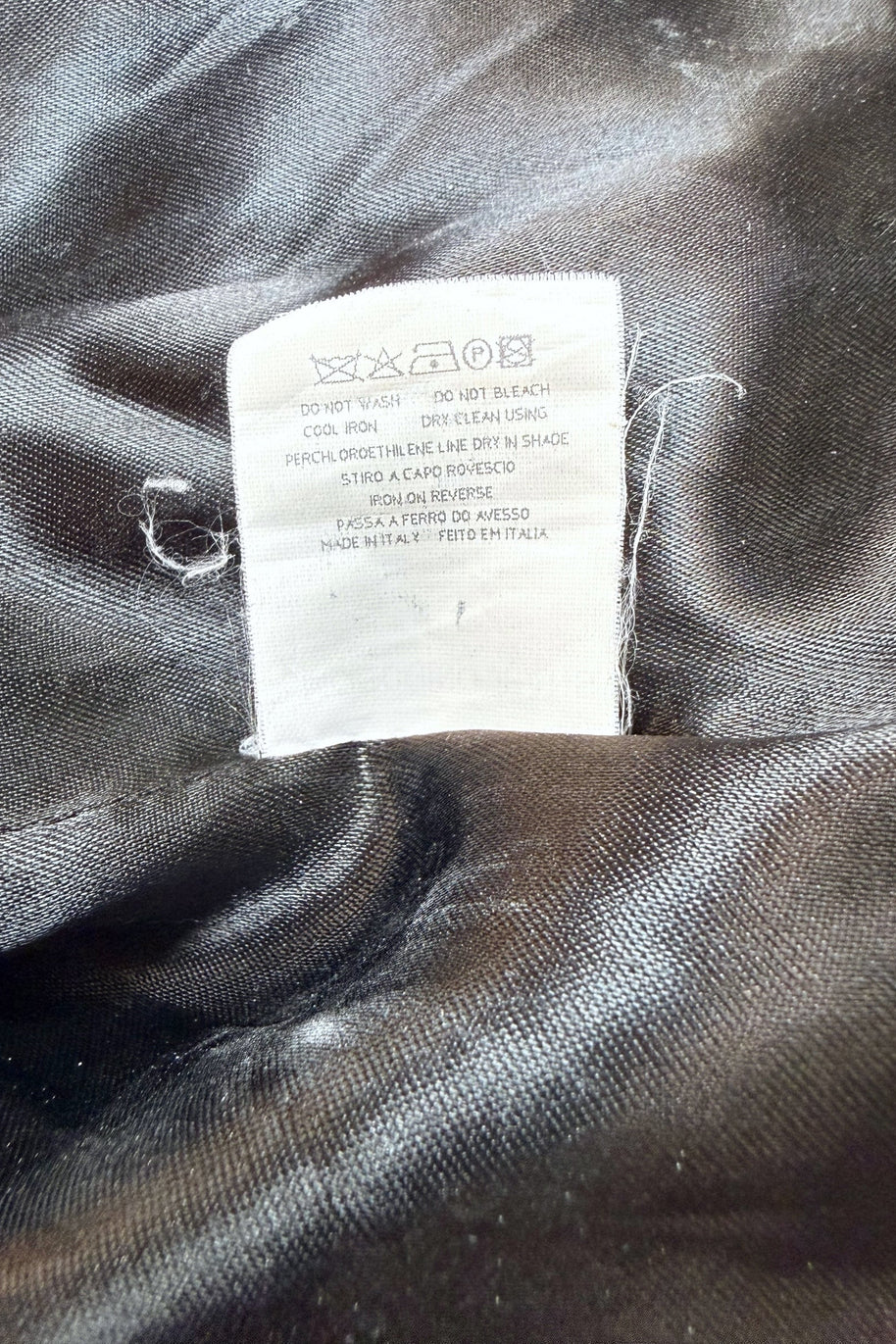 Care and fabric content label inside vintage Moschino Jeans blazer showing wool-blend shell and acetate viscose lining