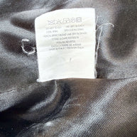 Care and fabric content label inside vintage Moschino Jeans blazer showing wool-blend shell and acetate viscose lining