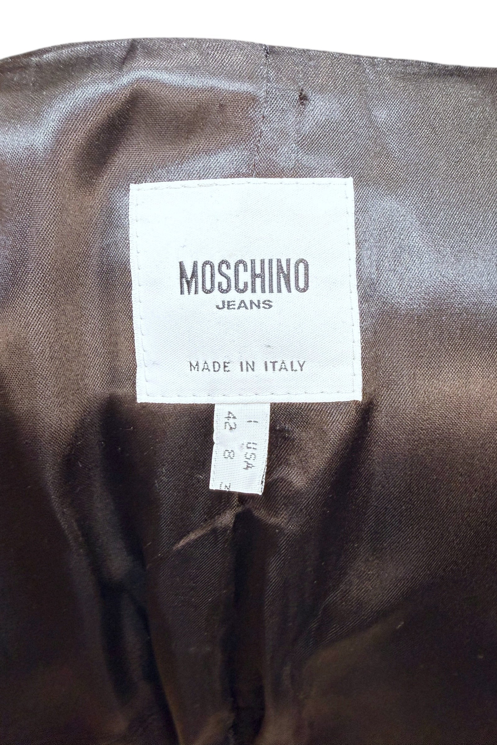 Interior label of vintage Moschino Jeans blazer reading Made in Italy with size and brand information