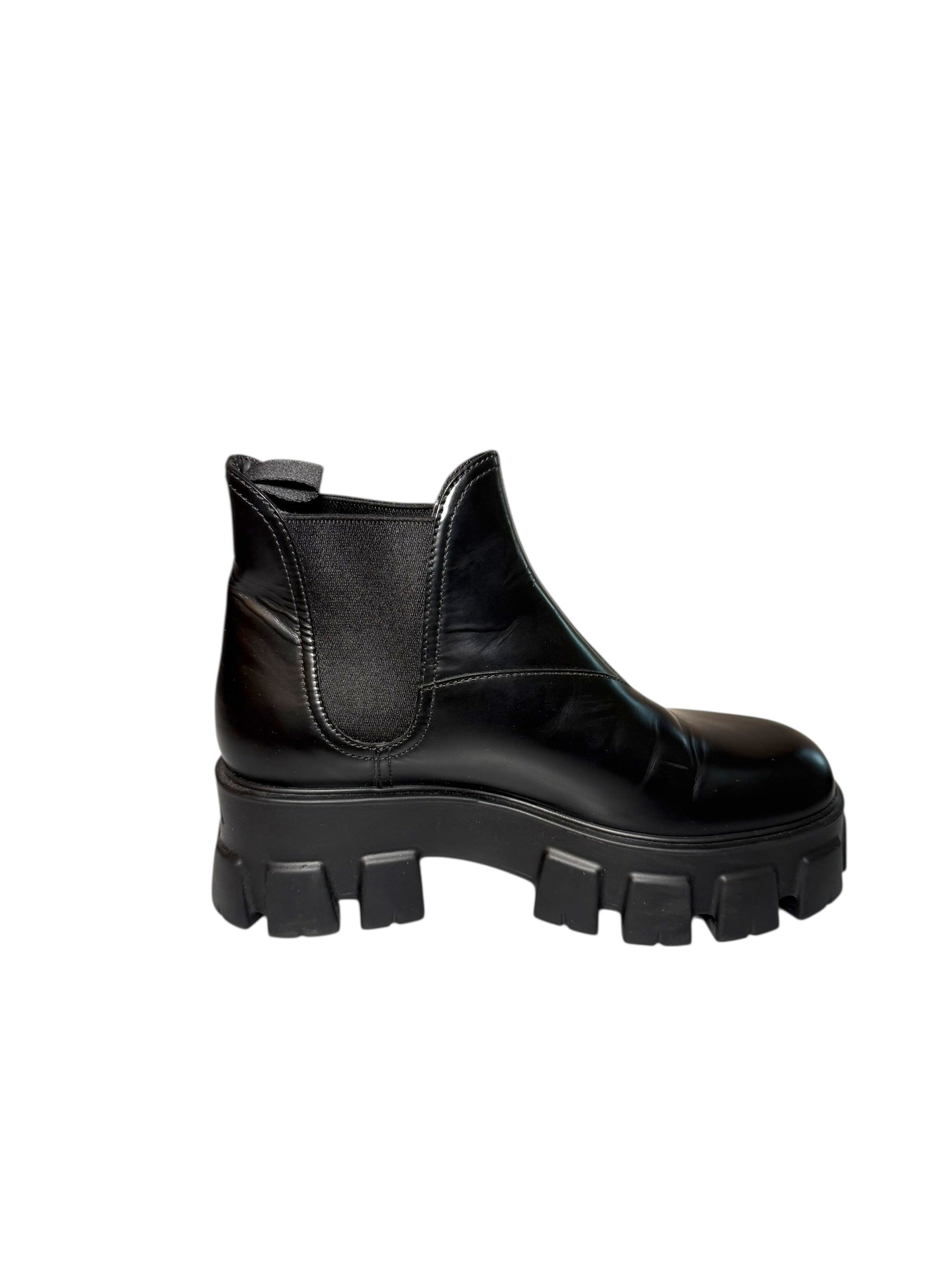 Prada Monolith Left Inside view of Black boot with chunky sole on a white background