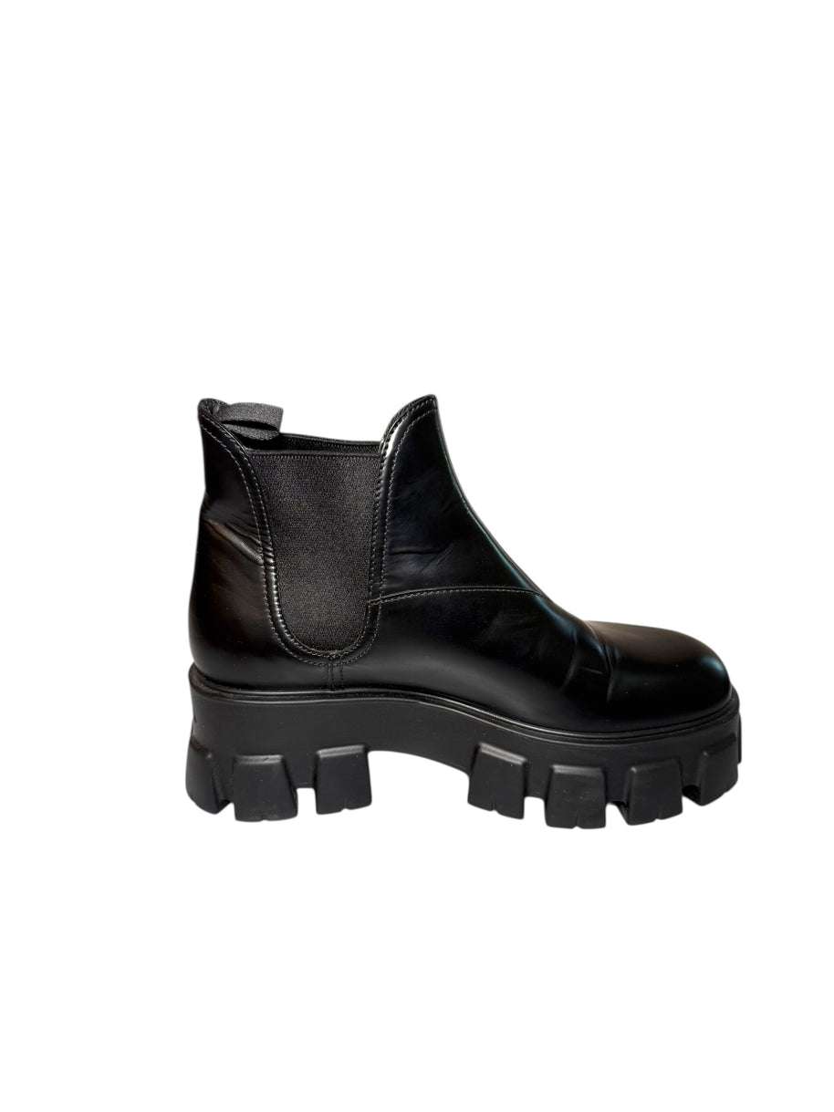 Prada Monolith Left Inside view of Black boot with chunky sole on a white background